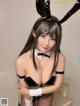 A woman in a bunny costume posing for a picture.