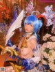 A woman with blue hair holding a sword in her hand.